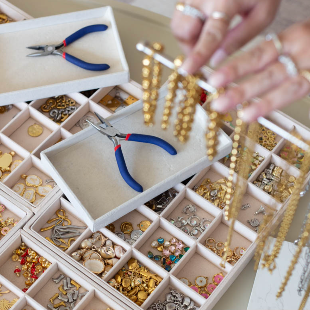 Charms and piliers set up for a workshop to assemble charm bracelets in Calgary.