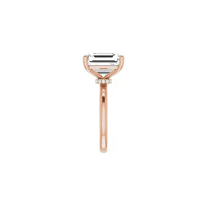 Hidden Halo with emerald centre stone in rose gold, side view