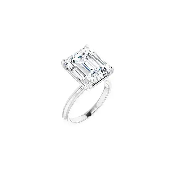 Hidden Halo with emerald centre stone in white gold, angled view