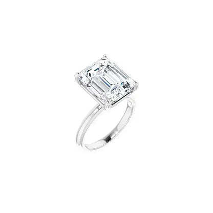Hidden Halo with emerald centre stone in white gold, angled view