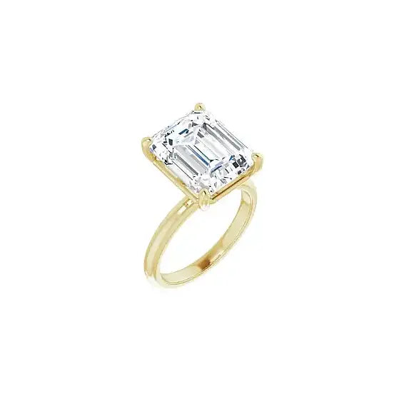 Hidden Halo with emerald centre stone in yellow gold, angled view