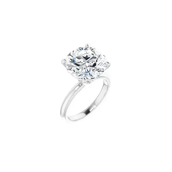 Hidden Halo with round centre stone in white gold, angled view