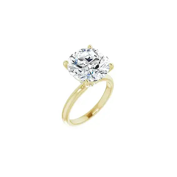 Hidden Halo with round centre stone in yellow gold, angled view