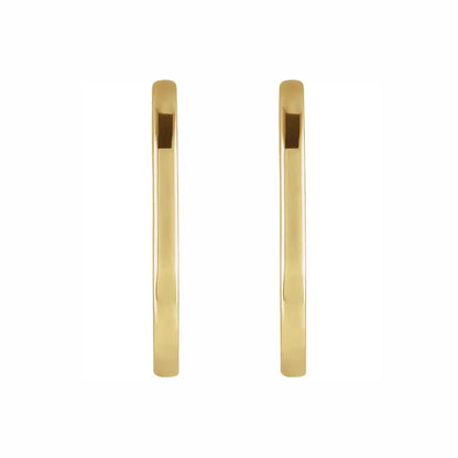 Oval huggies in yellow gold, front view