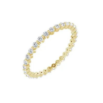 Petite Single Prong Eternity in yellow gold, angled view